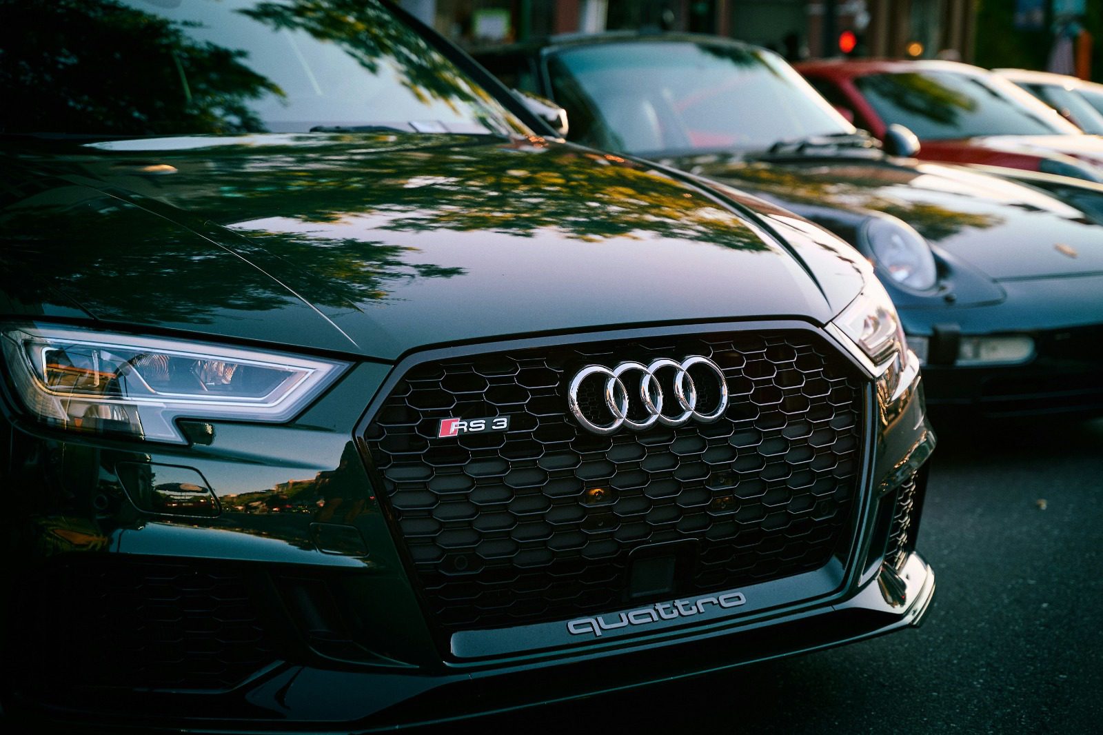 Sharp grille detail of an Audi at dusk light, representative of the marque profile work this page covers
